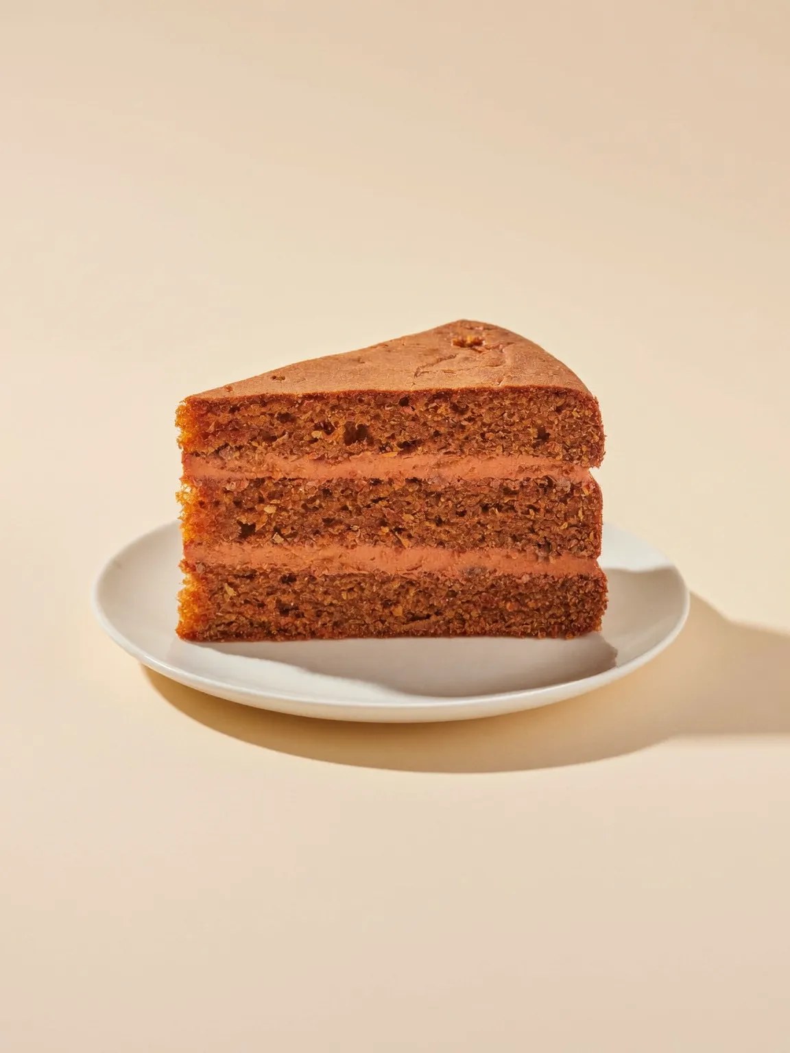 A slice of carrot cake on a small plate